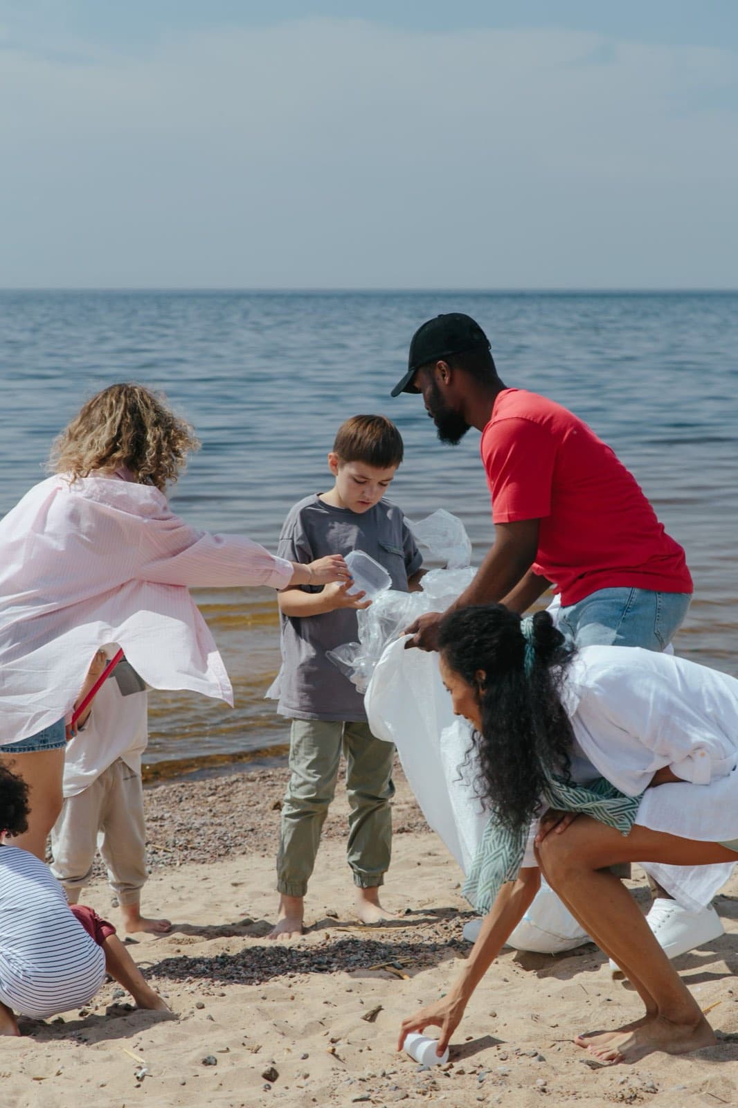 Volunteers cleaning up a coastal beach together